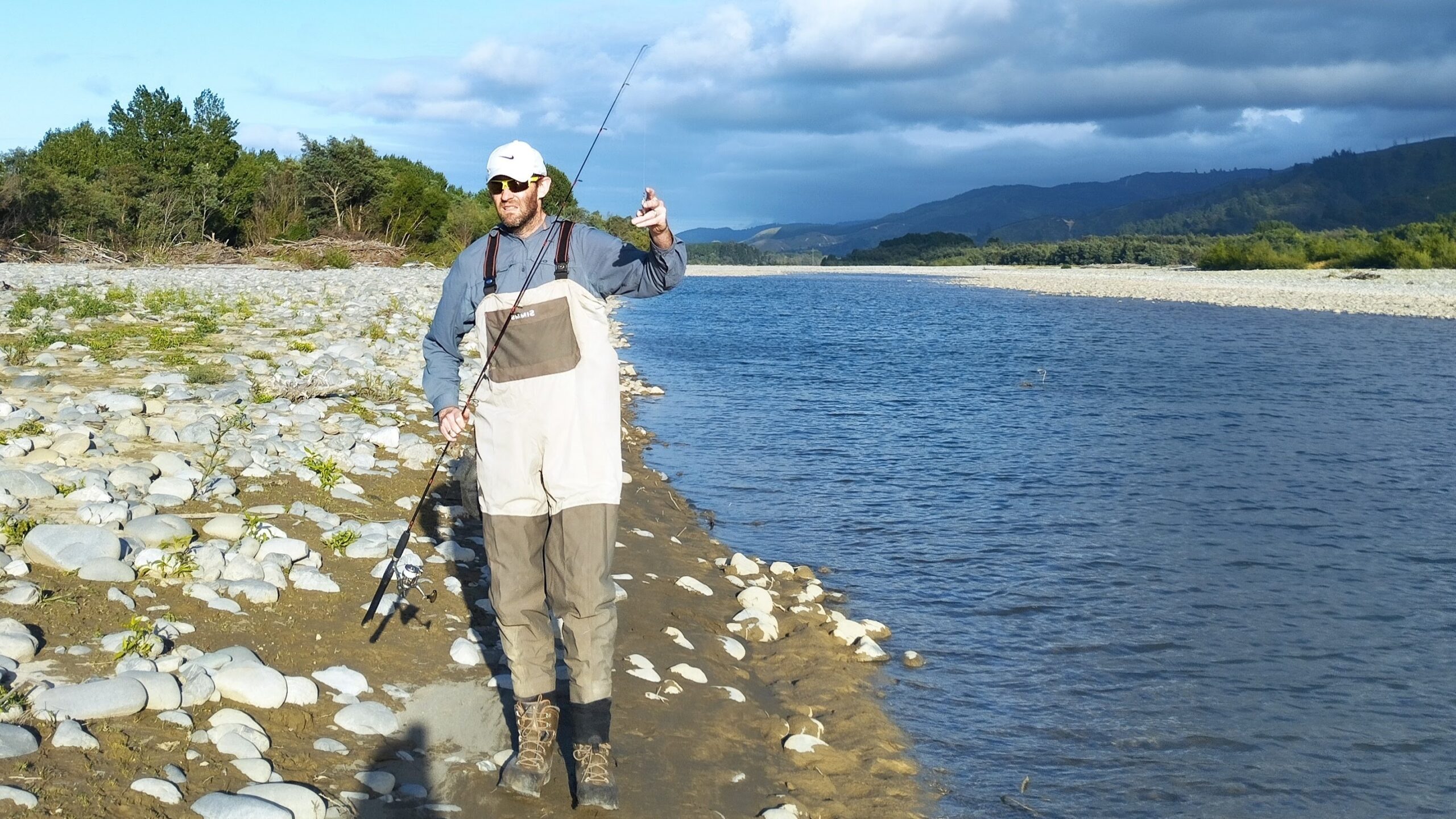 Standing by the river with one of my trout spinning rods. At 6'6" it is a good length for trout.