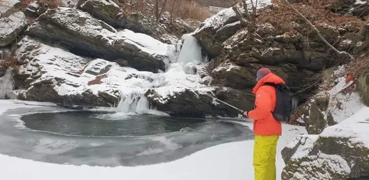Should I wear a down jacket while wading for trout?